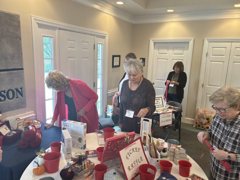 Members perusing the raffle table items